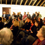 Group of people listening to a speaker in Arthouse New Canaan