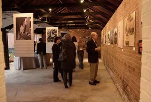 People checking out the artwork in art house new canaan